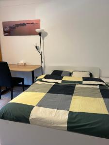 Cama ou camas em um quarto em Studio à Niederkorn