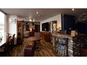 a living room with a table and a fireplace at Business Hotel B,loom - Vacation STAY 38188v in Tanabe