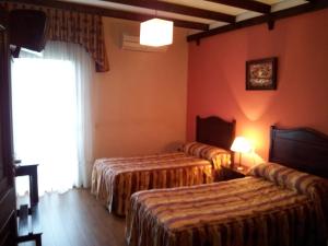 Posteľ alebo postele v izbe v ubytovaní Apartamentos El Mirador Del Soto