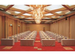 a large room with rows of tables and chairs at Hotel Tetora Resort Tsuruoka - Vacation STAY 39373v in Tsuruoka