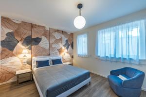 Postel nebo postele na pokoji v ubytování Trilocale Leonardo Treviglio Upper Stay
