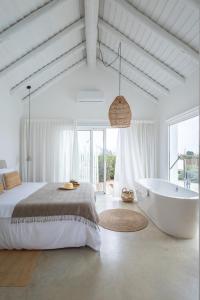Ένα ή περισσότερα κρεβάτια σε δωμάτιο στο Casa Calmar