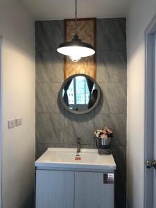 a bathroom with a sink and a mirror at Pai Casita walking street in Pai +16 photos
