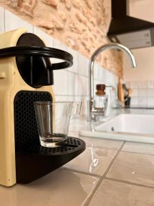 a glass on a holder on a kitchen counter at Casa Anguila in Amposta +20 photos
