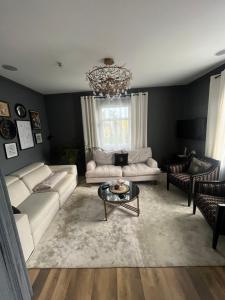 a living room with a couch and a table at No.10 Kwiatonowice in Kwiatonowice
