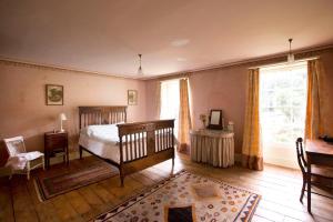 a bedroom with a bed and a window at ASHLEY COURT in Tiverton