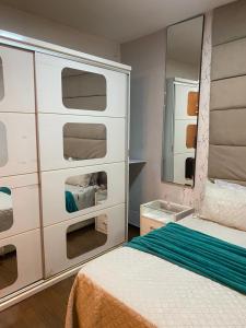 Ένα ή περισσότερα κρεβάτια σε δωμάτιο στο Sala e quarto próx ao Maracanã e Engenhão