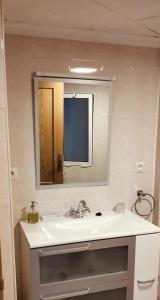 a bathroom with a sink and a mirror at El Almazán in Buñol +19 photos
