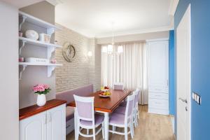 a kitchen and dining room with a table and chairs at Casa Dolce far niente , in Blue, PARKING in Sofia