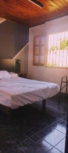 a bedroom with a bed and a window at Cabaña DON LITO in Ciudad Lujan de Cuyo