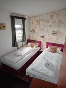 Postel nebo postele na pokoji v ubytování Guesthouse Yildiz