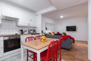a kitchen and living room with a table and chairs at Spacious 3-Bed Apt in Dublin Center in Dublin