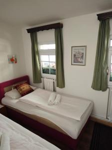Postel nebo postele na pokoji v ubytování Guesthouse Yildiz