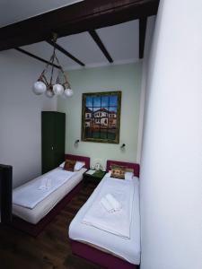 Postel nebo postele na pokoji v ubytování Guesthouse Yildiz