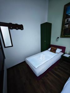 Postel nebo postele na pokoji v ubytování Guesthouse Yildiz