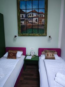 Postel nebo postele na pokoji v ubytování Guesthouse Yildiz