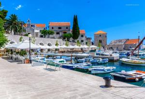 a group of boats are docked in a harbor at House Dinko in Bol