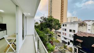 an apartment balcony with a view of a city at 401 studio apartment in El Peñon in Cali