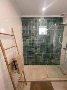 a bathroom with a shower with a glass door at Casa da Baixa in Faro +20 photos