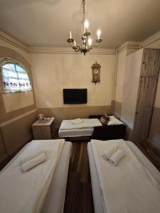 Postel nebo postele na pokoji v ubytování Guesthouse Yildiz