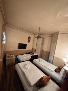 Postel nebo postele na pokoji v ubytování Guesthouse Yildiz