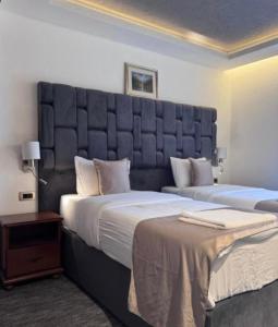 Uma cama ou camas num quarto em Hotel Garni Ideal
