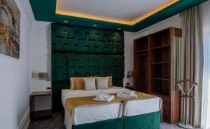 Uma cama ou camas num quarto em Hotel Garni Ideal