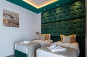 Uma cama ou camas num quarto em Hotel Garni Ideal