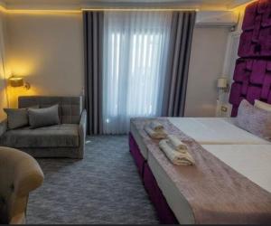 Uma cama ou camas num quarto em Hotel Garni Ideal