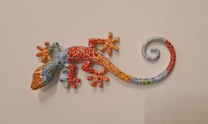 a lizard decoration hanging on a wall at The Salamadras in Arroyo de la Miel