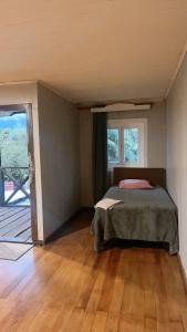 Postel nebo postele na pokoji v ubytování Hostal La Casona Ensenada con parking
