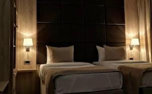 Uma cama ou camas num quarto em Hotel Garni Ideal