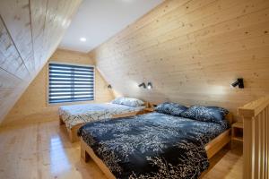 Llit o llits en una habitació de Holiday Home Ella Mokra Gora - Apartman Ella