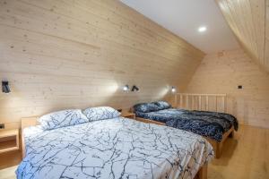Postel nebo postele na pokoji v ubytování Holiday Home Ella Mokra Gora - Apartman Ella