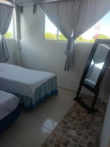 Ένα ή περισσότερα κρεβάτια σε δωμάτιο στο Casa Betancourt Habitaciones 301,302,303