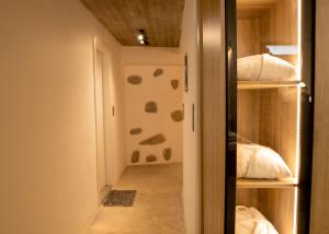 a room with a walk in closet with a door at Palmyra Villas Luxury in Kamilari
