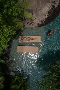 Bazén v ubytování The Kemilau Ubud nebo v jeho okolí