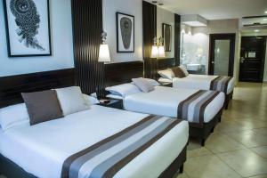Voodi või voodid majutusasutuse Hotel Las Cascadas toas