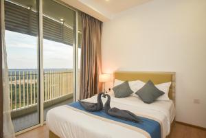 Postel nebo postele na pokoji v ubytování Encorp Marina Suites by Nest Home at Puteri Harbour