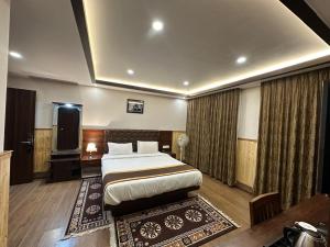 Ένα ή περισσότερα κρεβάτια σε δωμάτιο στο Hotel Lha-yul nearby MG Road Gangtok