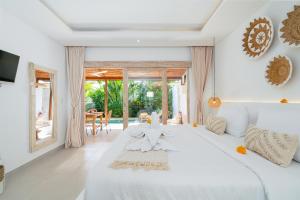 Ένα ή περισσότερα κρεβάτια σε δωμάτιο στο Villa Diana 2 in Nyanyi +51 φωτογραφίες