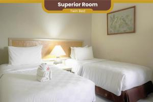 Voodi või voodid majutusasutuse The Jayakarta Yogyakarta Hotel & Spa toas