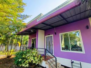 a purple house with a porch at Little Purple House 2- AoNang in Ao Nang 