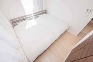 Postel nebo postele na pokoji v ubytování New Open! Collab House 富士山眺望 送迎無料 BBQ 器具無料貸出