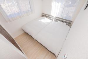 Postel nebo postele na pokoji v ubytování New Open! Collab House 富士山眺望 送迎無料 BBQ 器具無料貸出