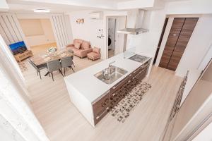Kuchyň nebo kuchyňský kout v ubytování New Open! Collab House 富士山眺望 送迎無料 BBQ 器具無料貸出