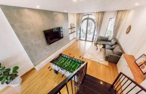 an aerial view of a living room with a table at Gấu House Villa in Da Lat