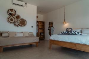 Krevet ili kreveti u jedinici u okviru objekta Sunscape Villa - Beachfront and private pool
