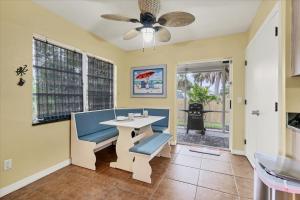 a dining room with a table and a ceiling fan at BRC18614 in Port Charlotte