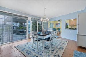 a dining room with a table and chairs at BRC18614 in Port Charlotte +16 photos